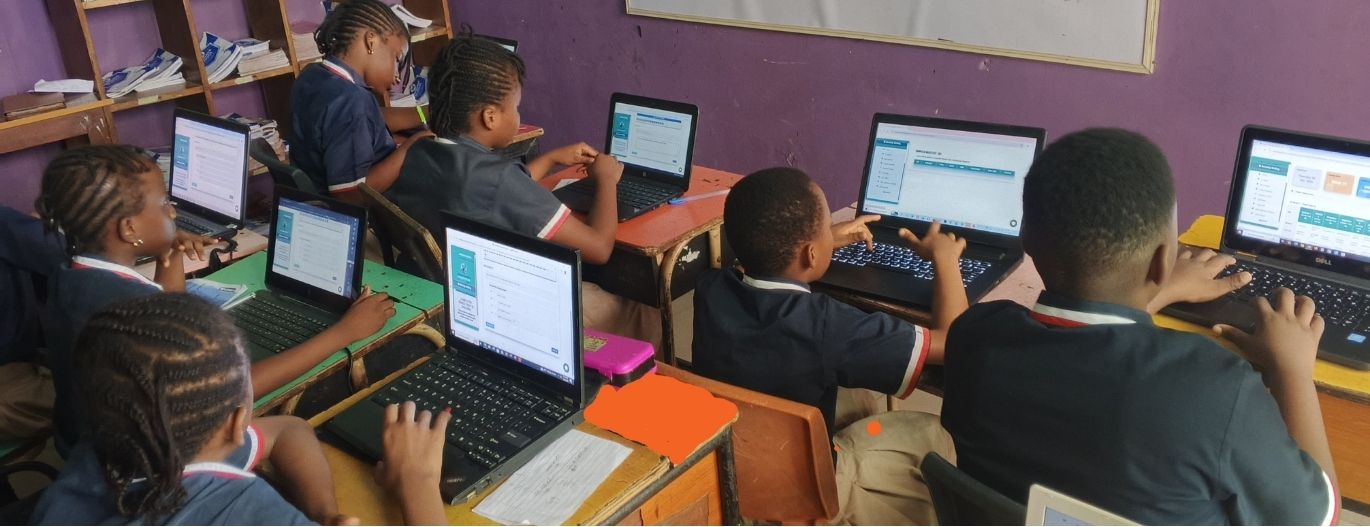 Dandave School pupils learning with a laptop